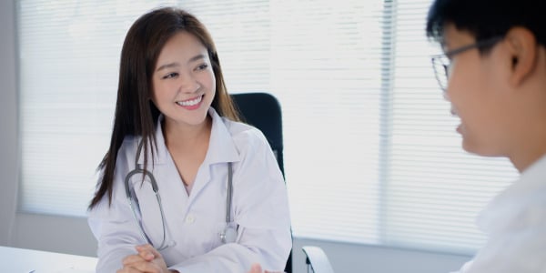 Nurse speaking with patient