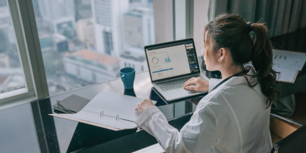 Nurse Looking at healthcare dashboards