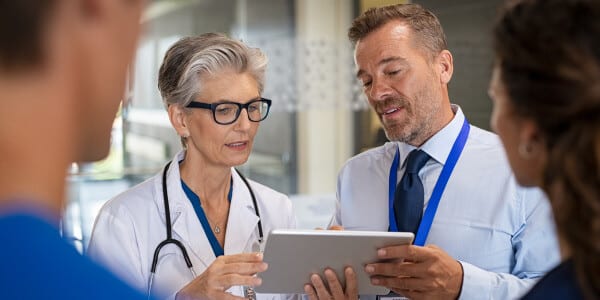 Nurses looking at records