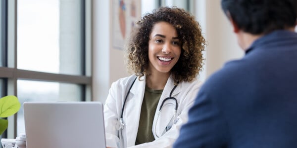 Nurse speaking with a patient