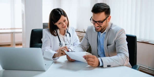 Nurse practitioner looking at paperwork