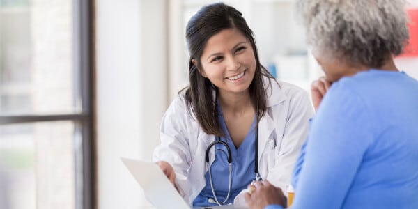 Picture of a nurse working with a patient