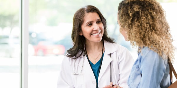 Nurse speaking to patient